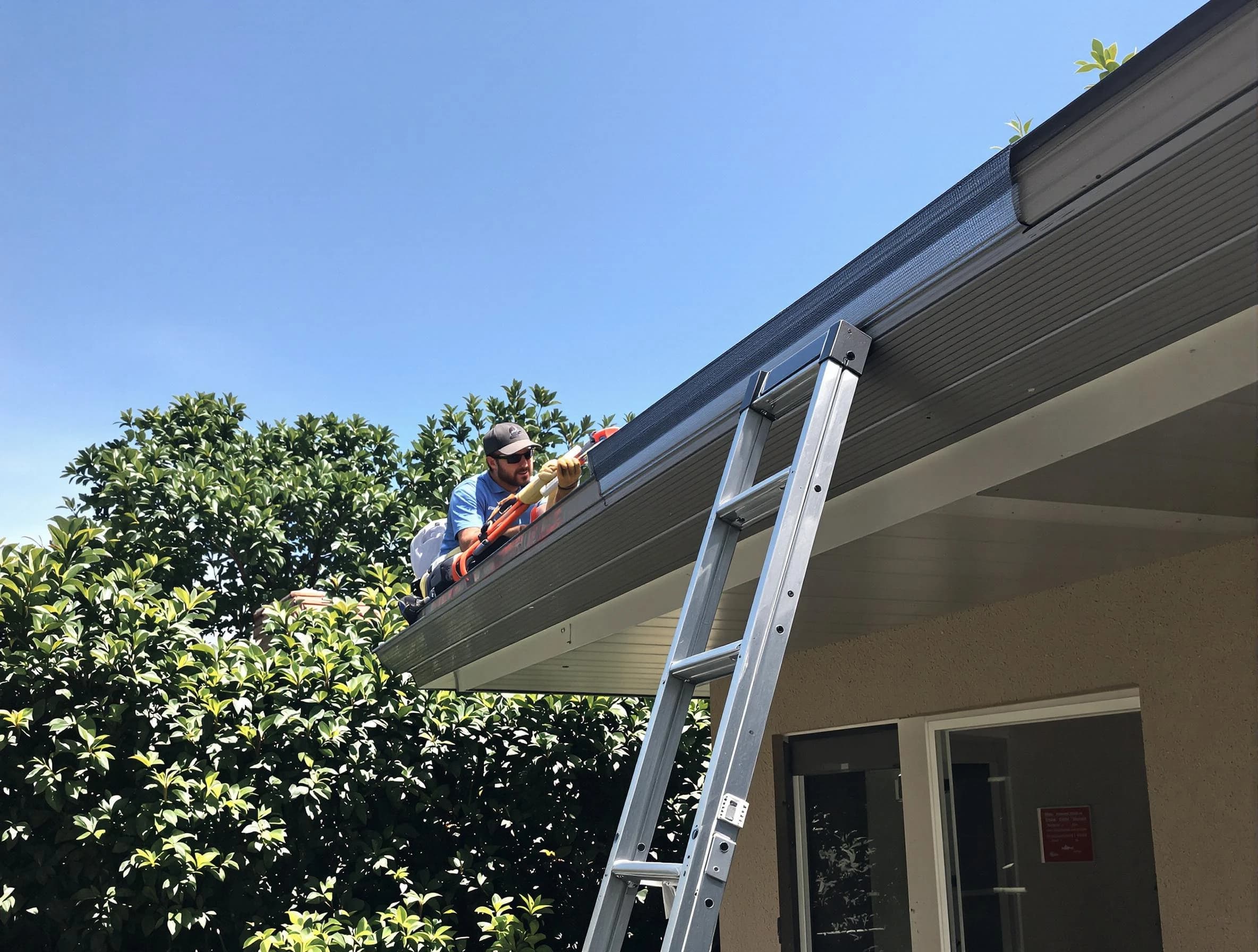 Middleburg Heights Roofing Company installing gutter guards for a homeowner in Middleburg Heights, OH